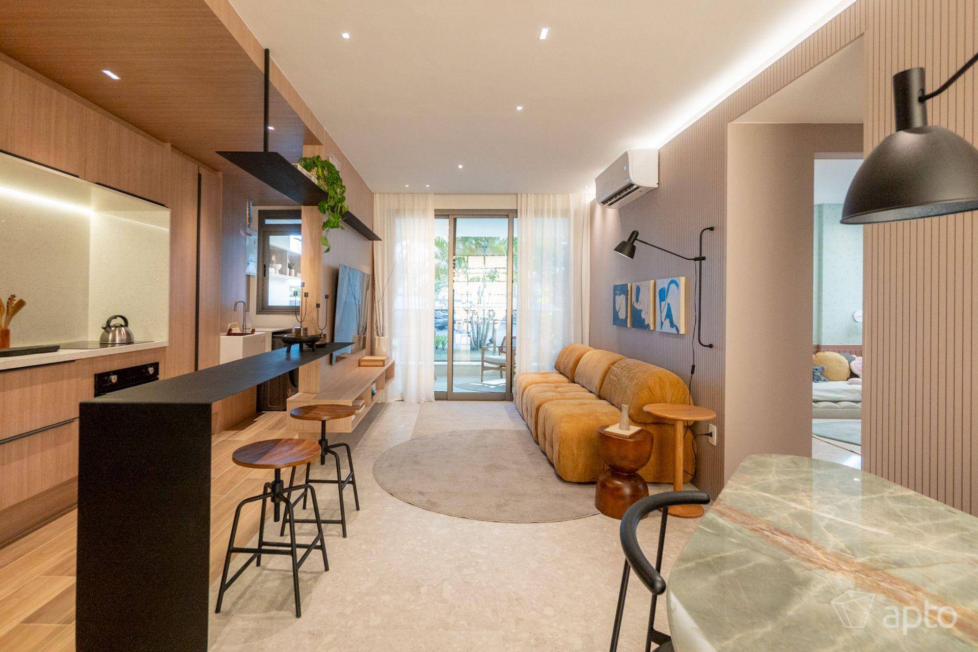 Apartamento decorado modelo do Astra com sala integrada, cozinha americana e varanda